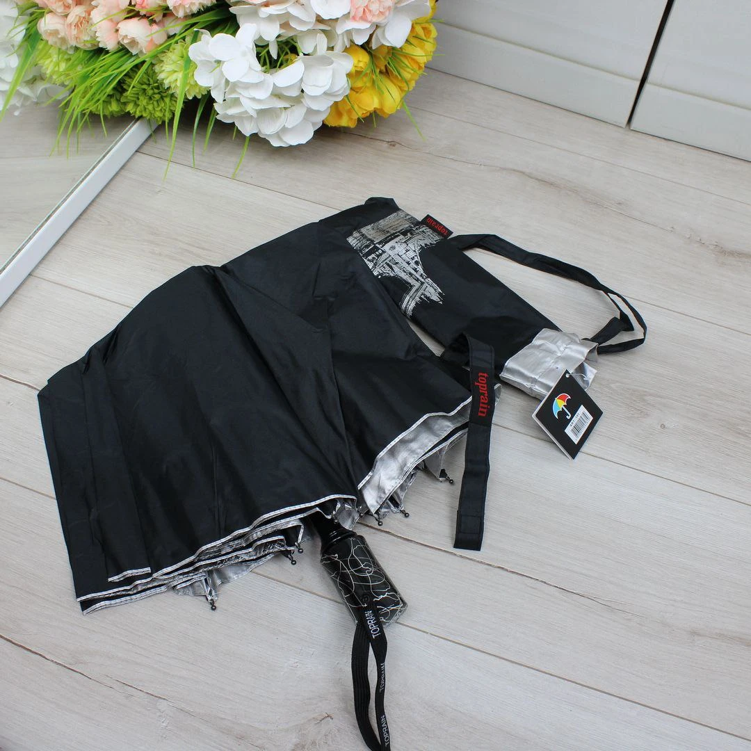 Чорна парасолька напівавтомат з однотонним куполом і декоративним візерунком усередині