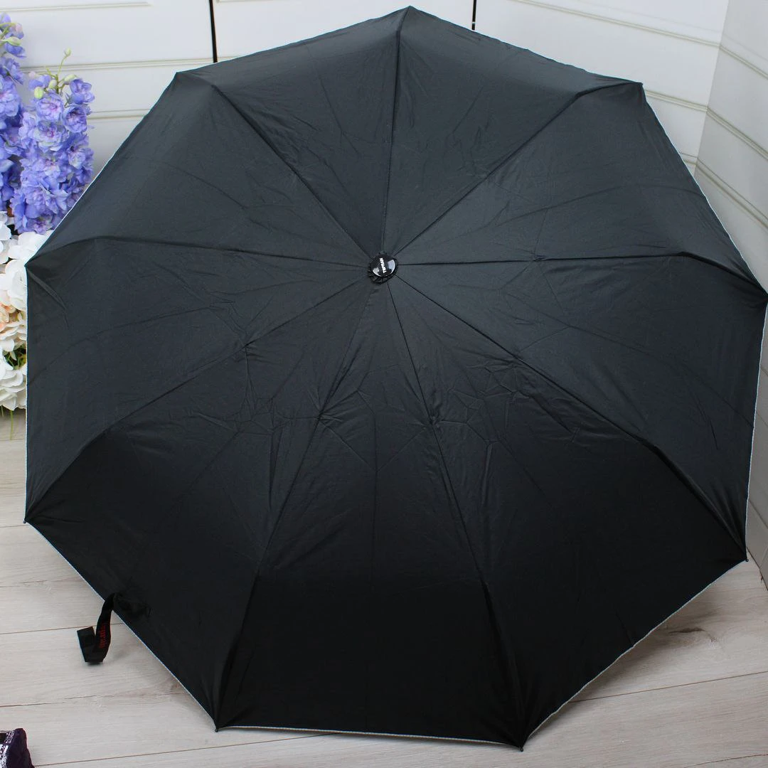 Чорна парасолька напівавтомат з однотонним куполом і декоративним візерунком усередині