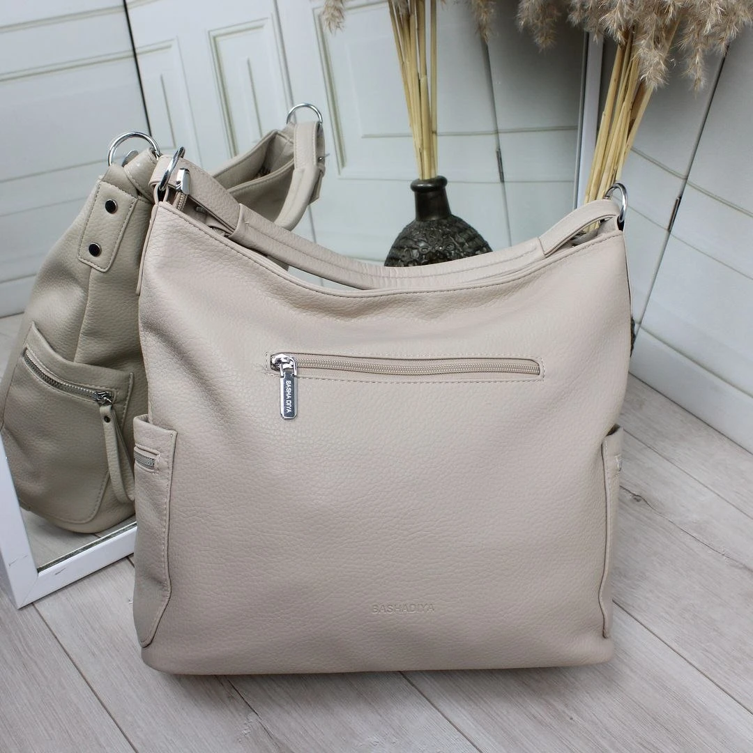 Бежева жіноча сумка-мішок через плече вміщує А4 з екошкіри