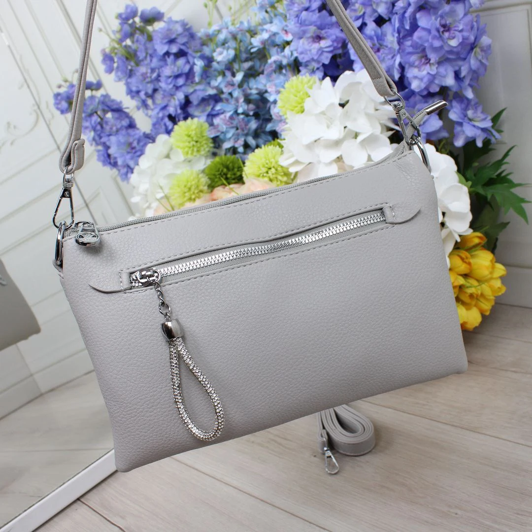 Сіра жіноча сумка крос-боді з екошкіри для подорожей